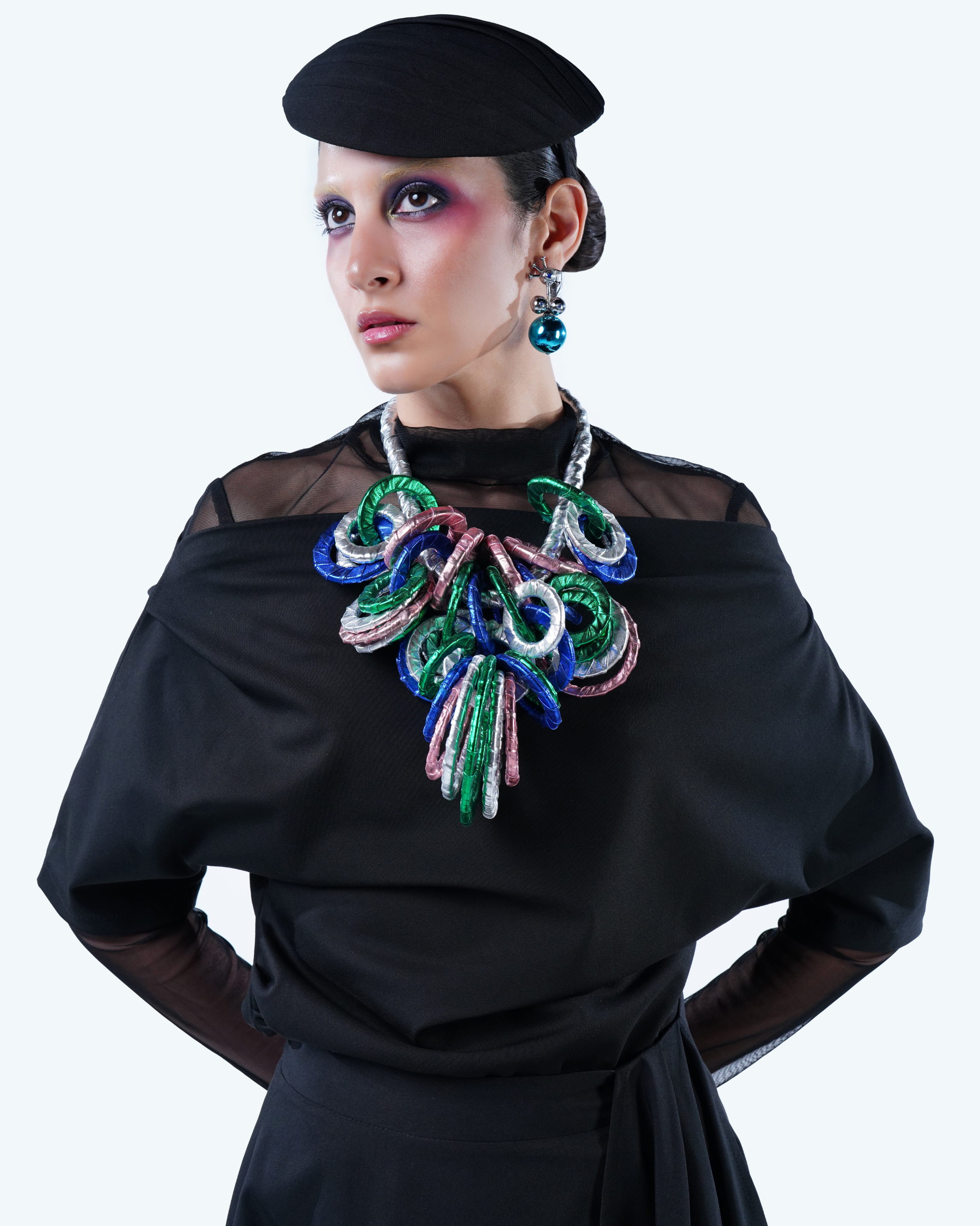 Model wearing Hüna Linen Asymmetrical Blouse – draped neckline and fluid silhouette from the Volume Noir Collection.