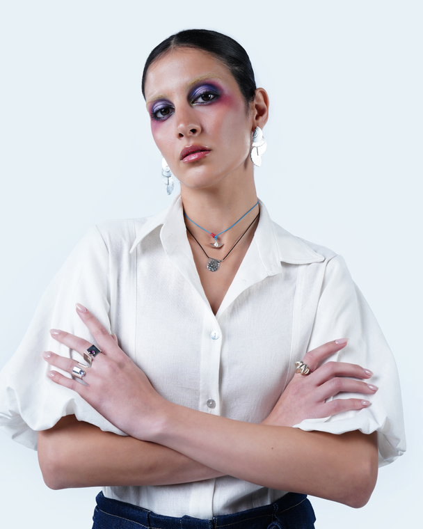 Model wearing Hüna Linen Balloon-Sleeve Blouse – linen blend blouse with voluminous sleeves and classic collar from the Volume Noir Collection.