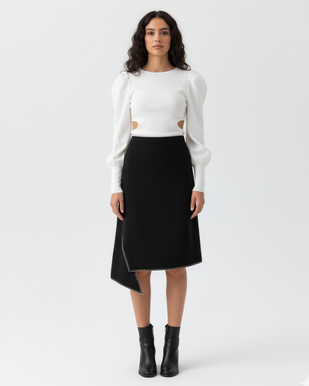 Model wearing Hüna Afra Skirt — black crepe asymmetrical skirt with decorative stitches